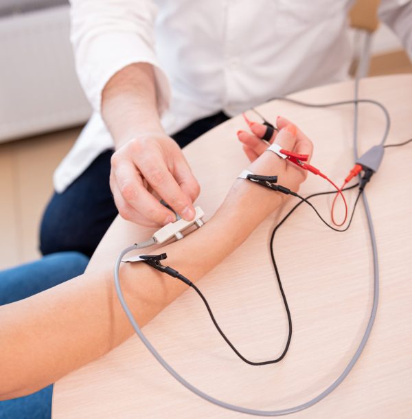 Patient nerves testing using electromyography at medical center.